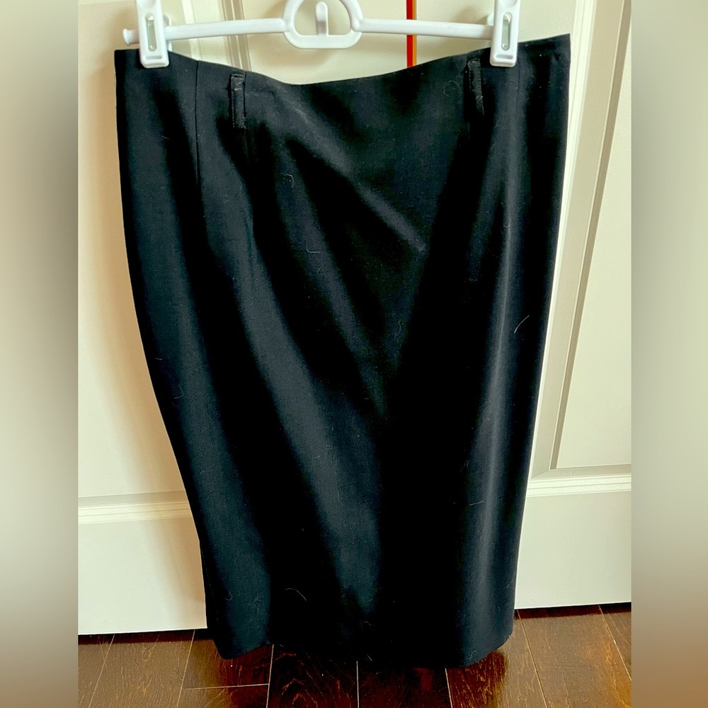 Black Talbots skirt. Hits below knee.